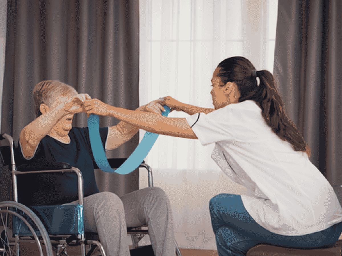 Caregiver holding hands with an older woman living with dementia at home in Spring Hill, TN