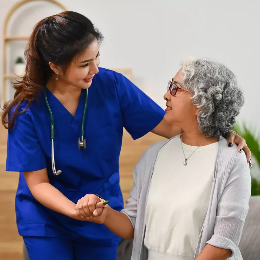 caring-woman-helping-senior-woman-at-home-2026-03-17-17-43-51-utc.webp