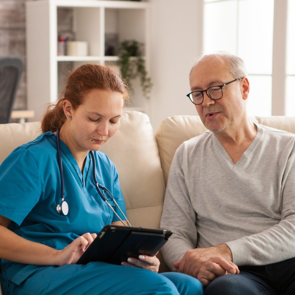 Caregiver supporting a senior at home